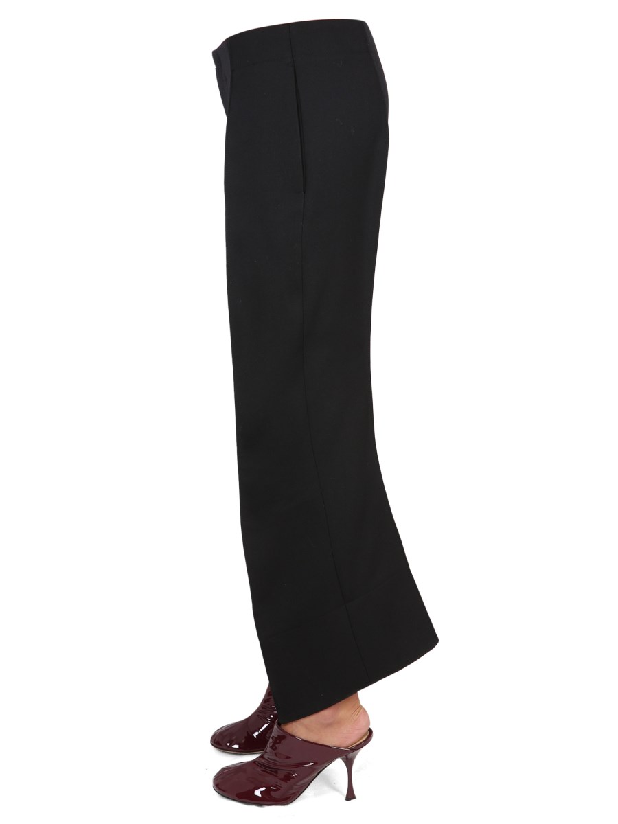 BOTTEGA VENETA PANTALONI IN LANA COMPATTA CON GAMBE CURVE