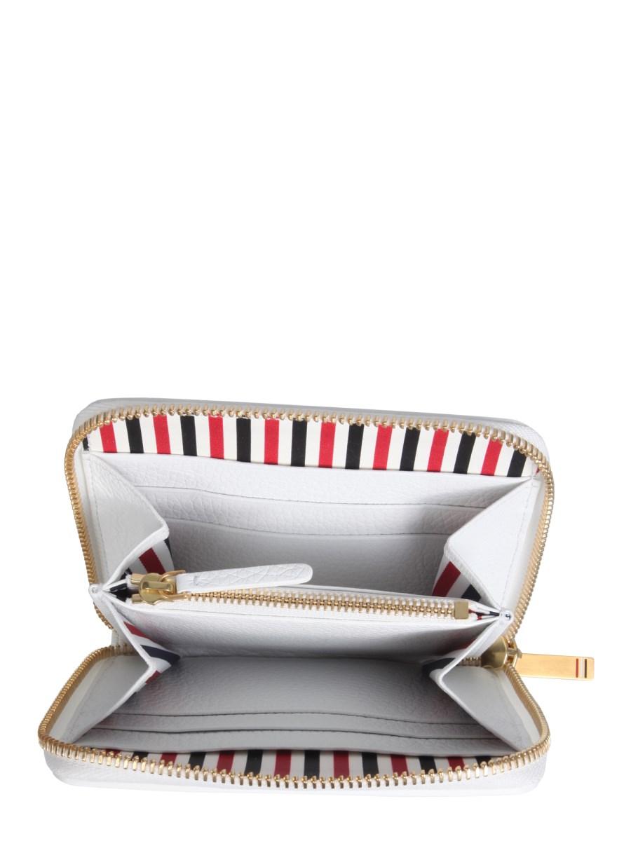 THOM BROWNE PORTAFOGLIO IN PELLE CON ZIP E DETTAGLI BROGUING