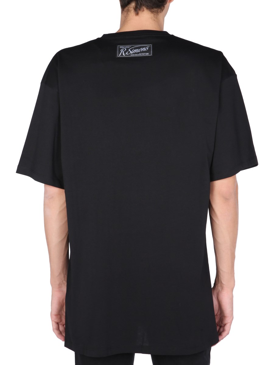 RAF SIMONS T-SHIRT IN JERSEY DI COTONE CON DETTAGLI STAMPATI FRONTALI