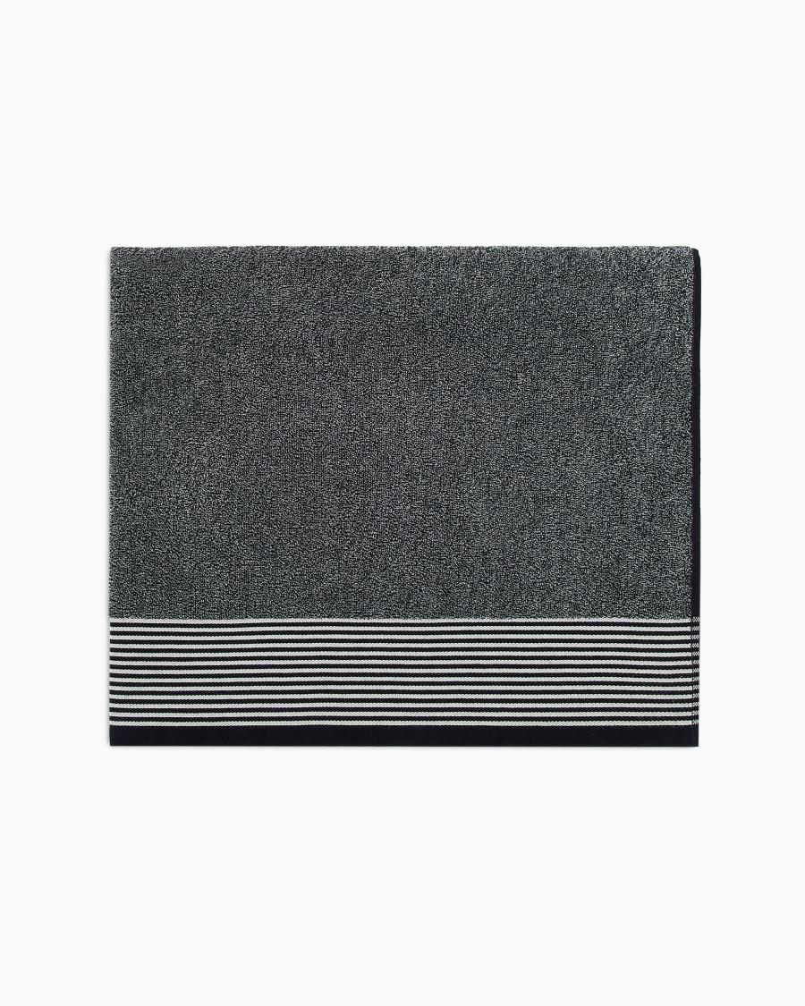 The world of armani TELO MARE IN SPUGNA DI COTONE CON MAXI LOGO GA JACQUARD