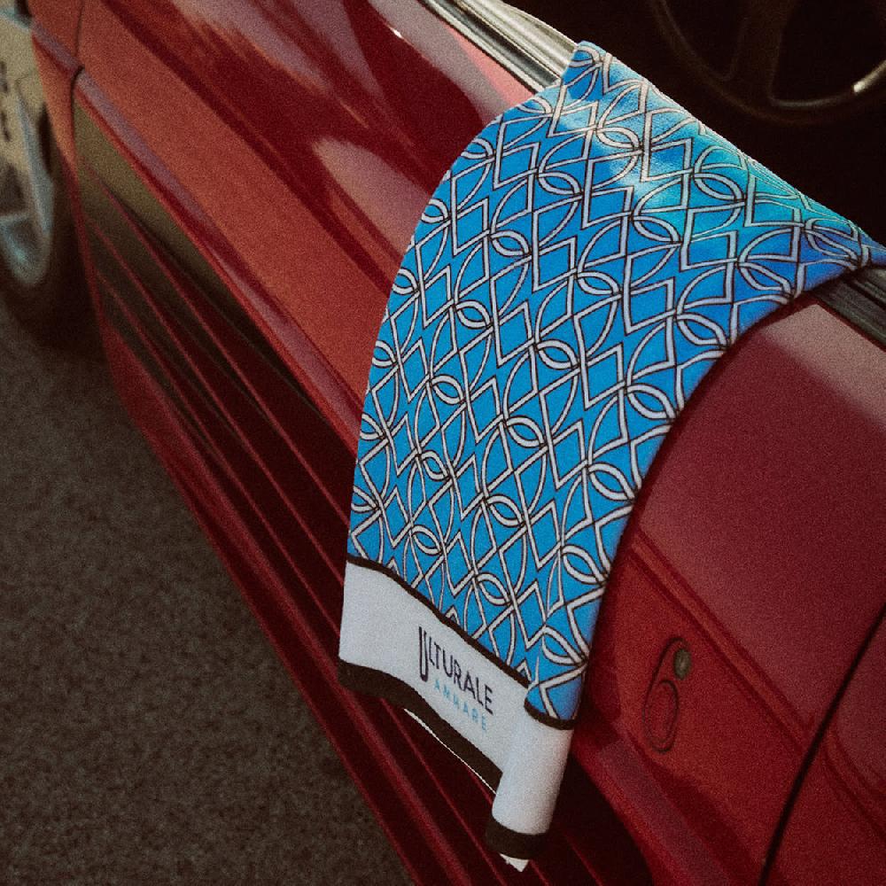 Ulturale Telo mare fantasia geometrica su fondo azzurro in poliestere e cotone - Ulturale