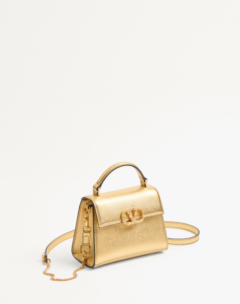 Valentino Handbags Borsa A Mano Mini Valentino Garavani Vsling In Vitello Granato Laminato Con Logo Gioiello Per Donna In Antique Brass | Valentino IT