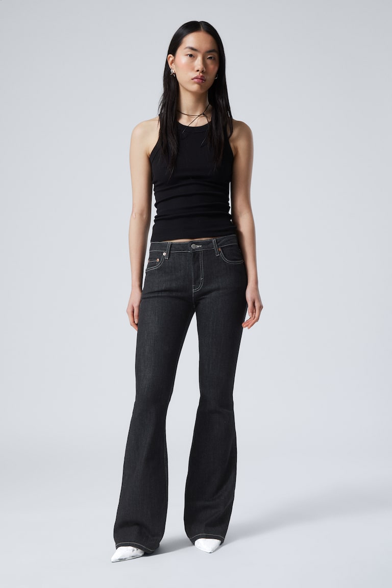 H&M Jeans Flame flared a vita bassa vestibilità slim - Lavaggio nero – Nero - DONNA