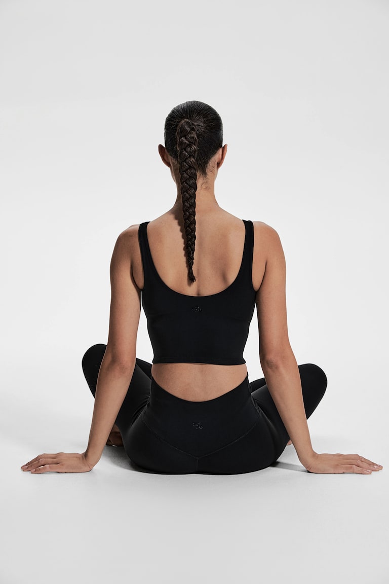 H&M Reggiseno yoga con SoftMove™ Lycra® Light Support - Nero - DONNA