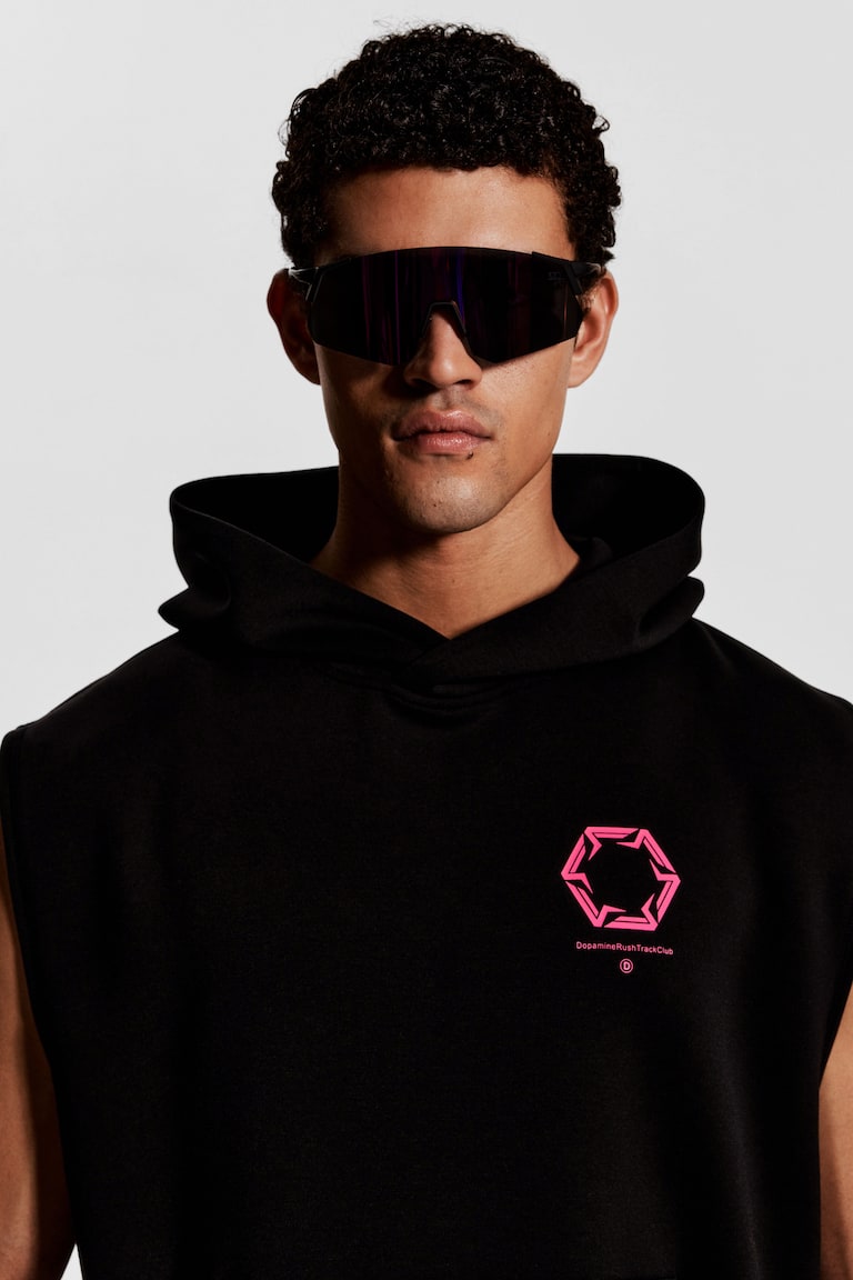 H&M Top sportivo smanicato con DryMove™ Loose fit - Nero/Dopamine Rush - UOMO